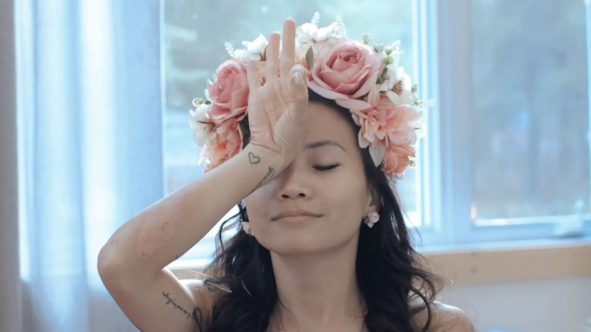 Ella channeling Light Language codes with a flower crown on